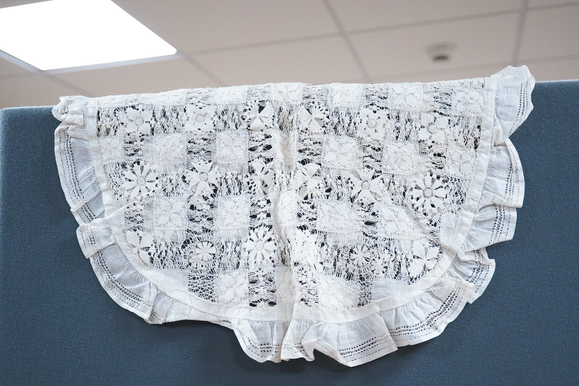 An ornate pineapple linen table cloth - 220cm x 190cm and a similar tea cosy, together with a collection of crochet edged, embroidered and cutwork table linens.